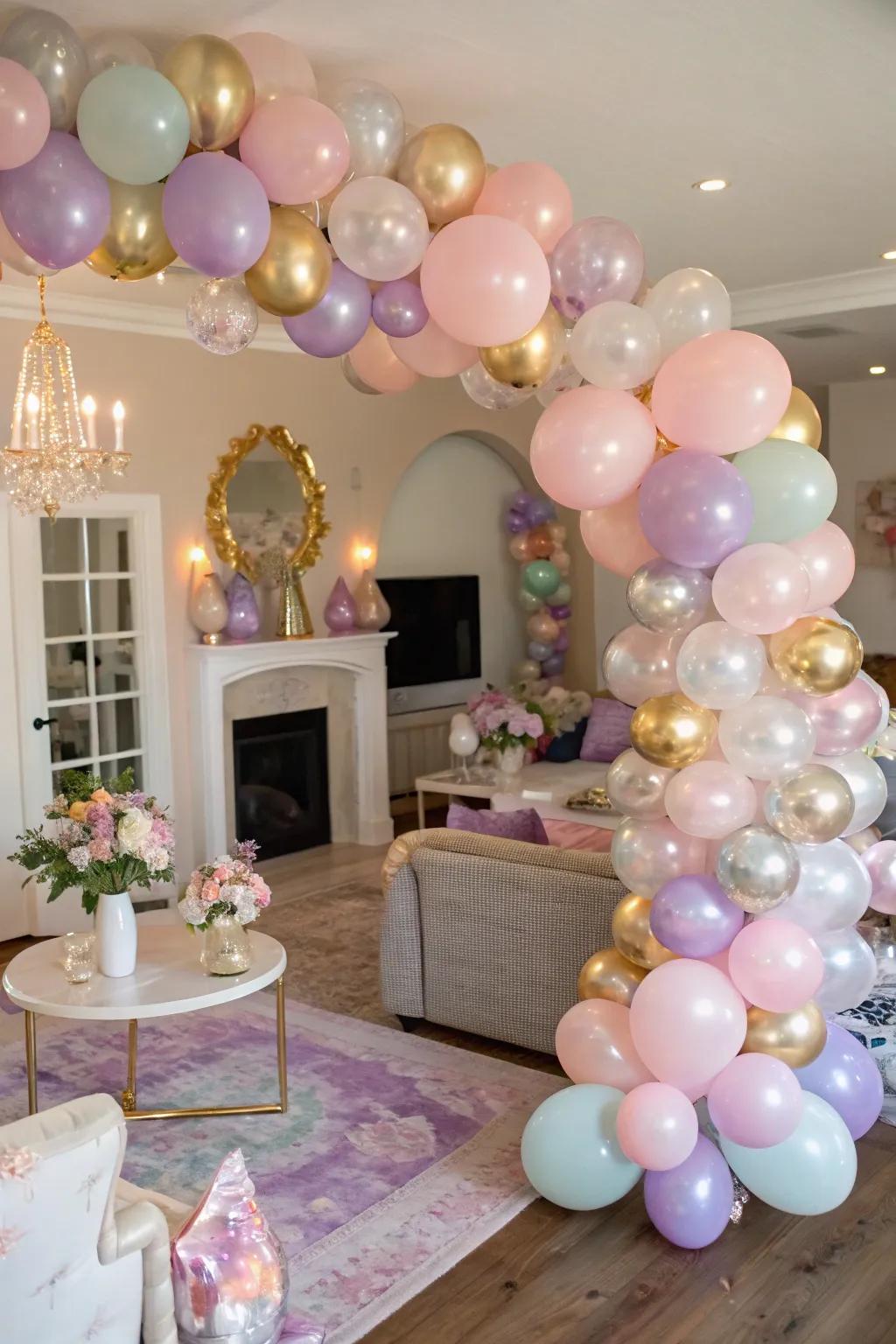 A living room adorned with a chic balloon arch in pastel and metallic colors.