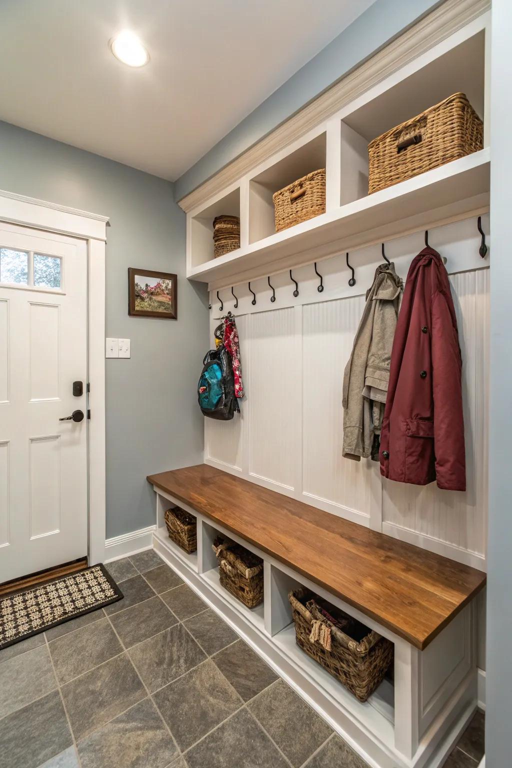 A narrow nook elegantly transformed into a functional mudroom.