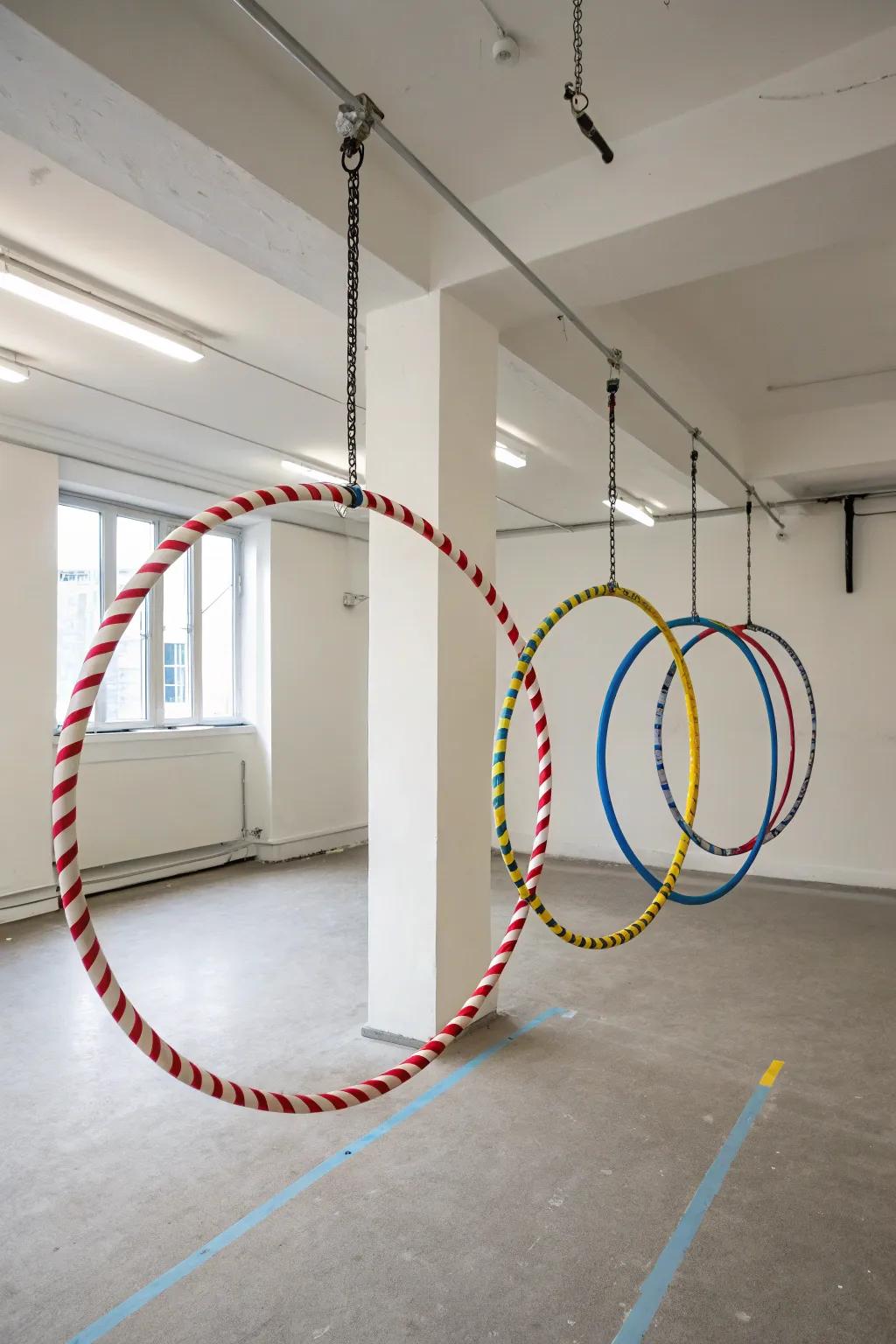 Hula hoops artistically suspended from ceiling hooks, creating a functional and decorative display.