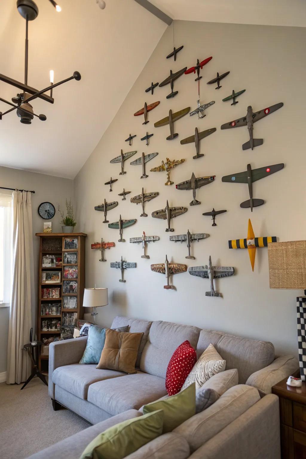 Model airplanes arranged on the wall create an eye-catching art piece.