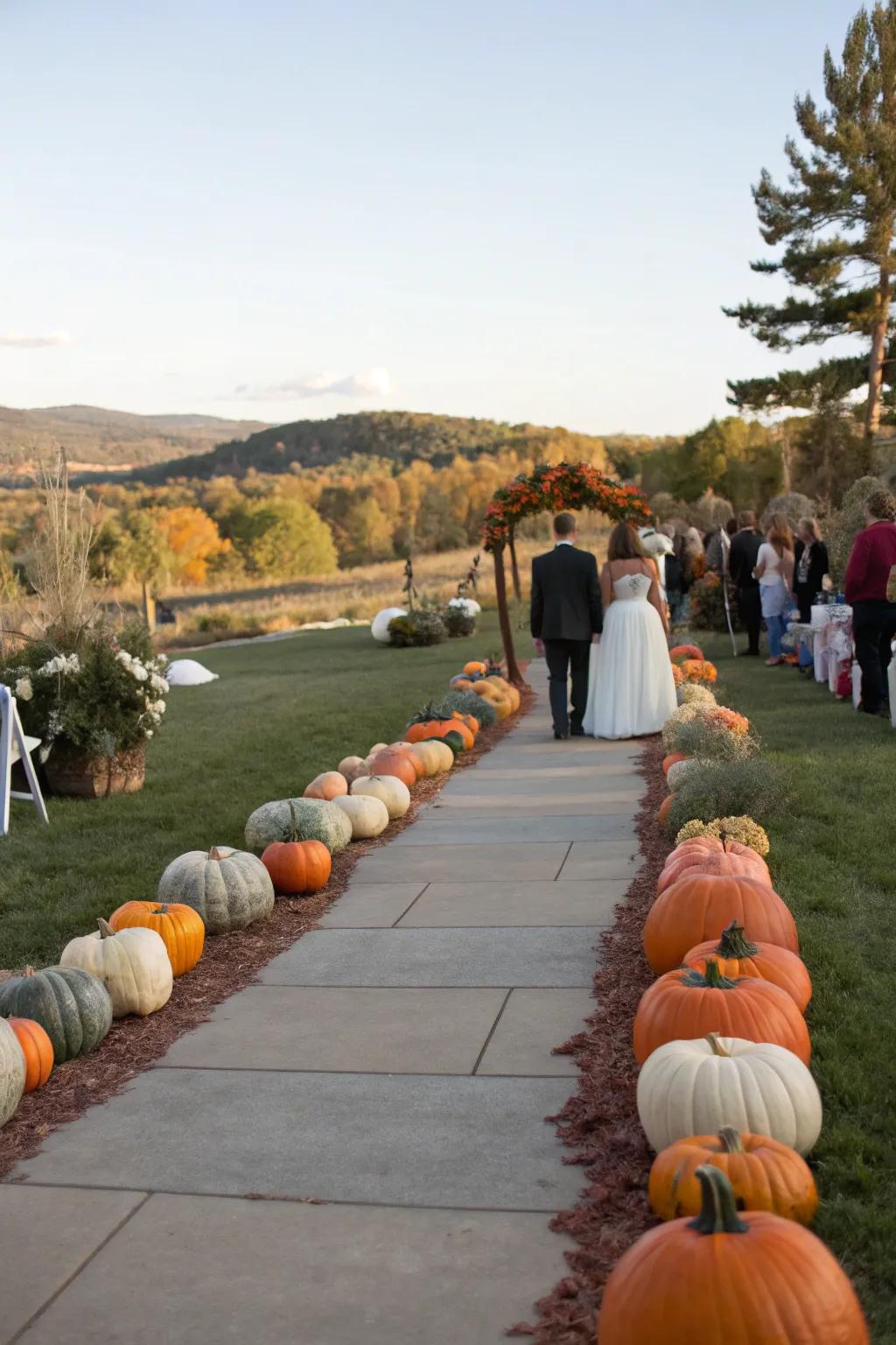 A charming pathway lined with pumpkins leading to a wedding ceremony.