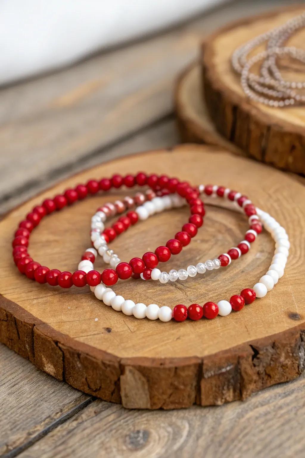 Stylish red and white beaded bracelets add flair to any outfit.