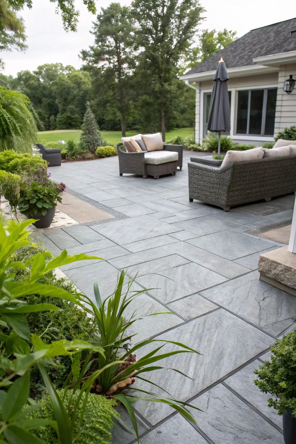 A sleek gray stamped concrete patio that exudes modern elegance.