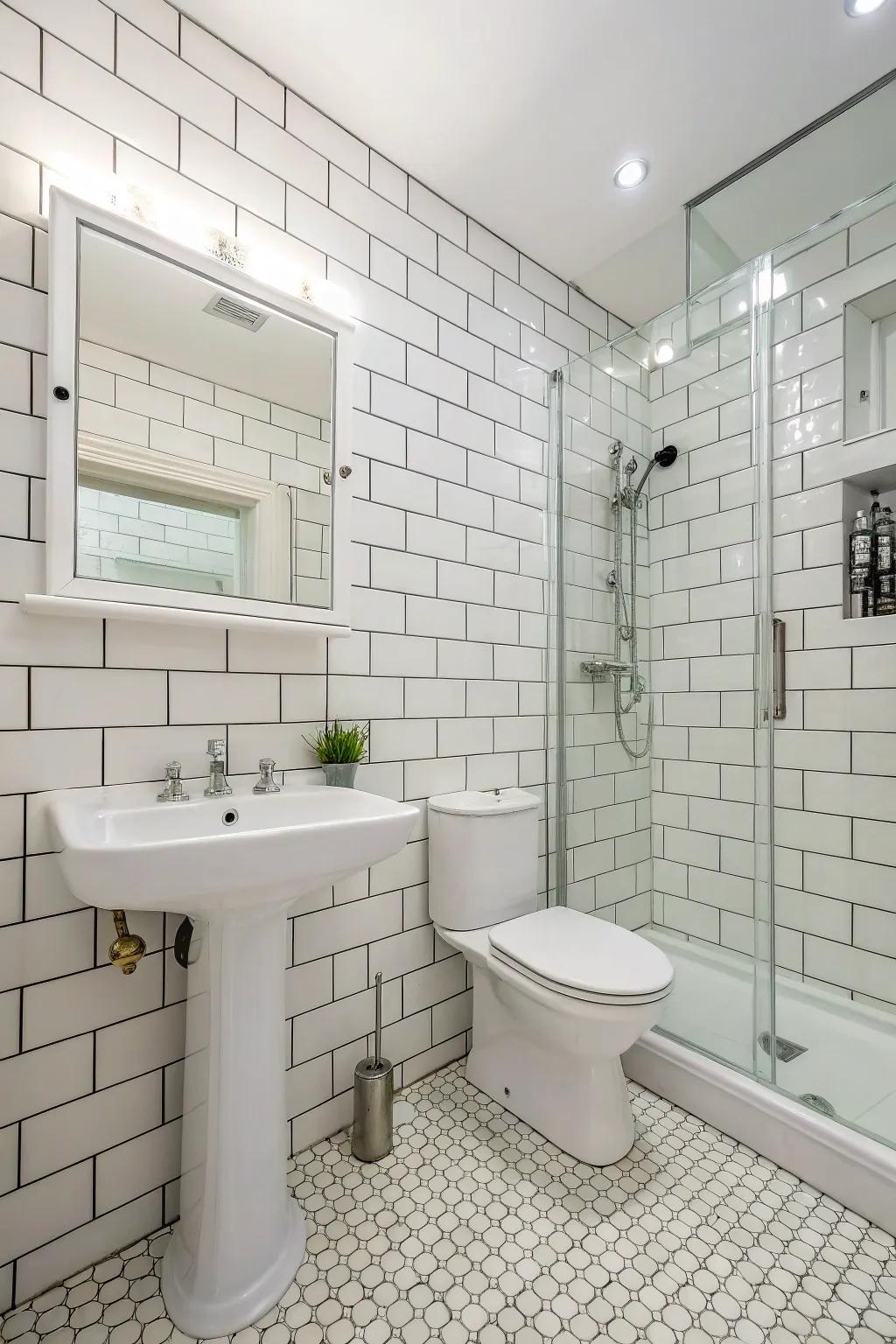 Classic white-on-white tile design for a clean and expansive feel.