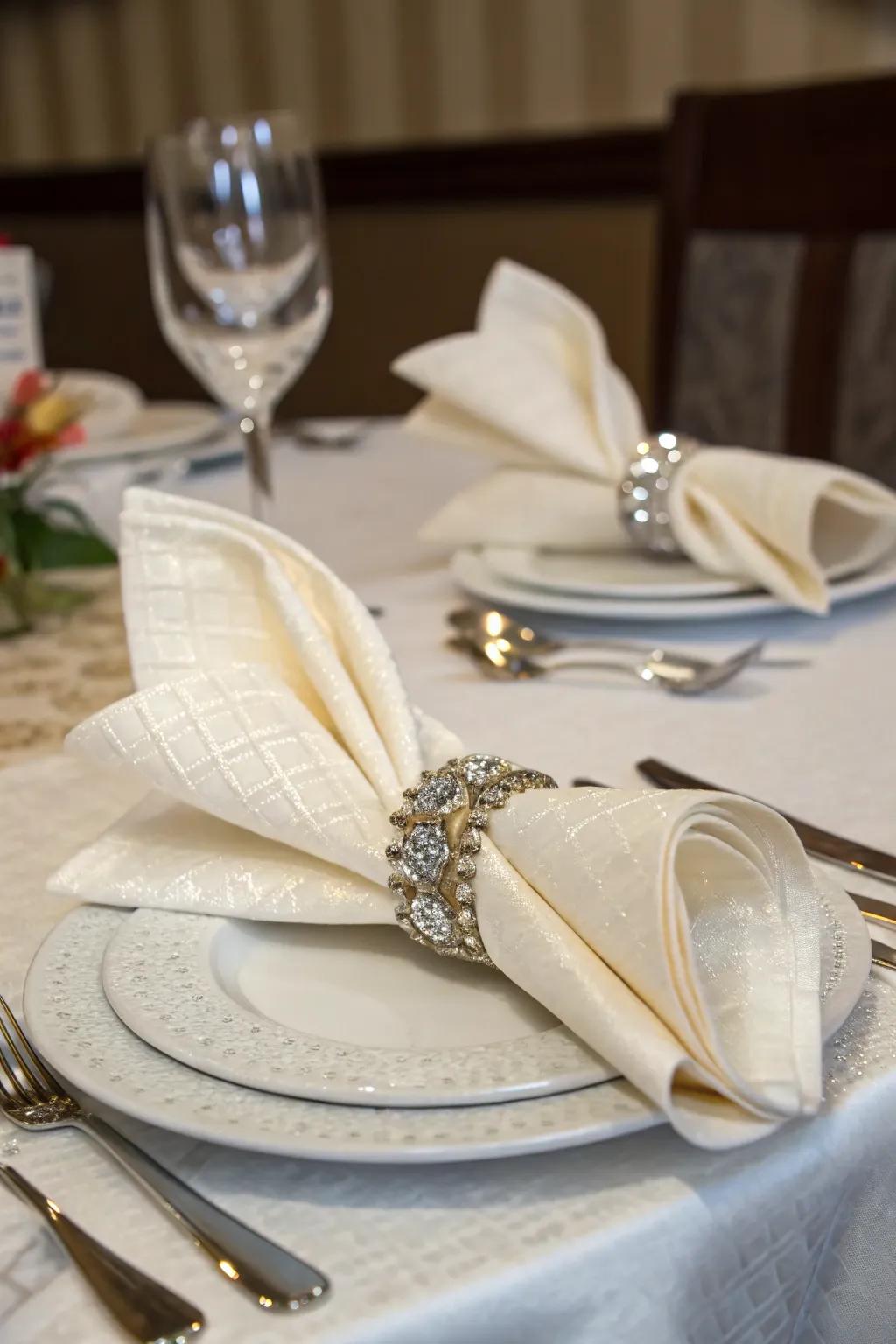 Chic napkin presentation with rings and folds