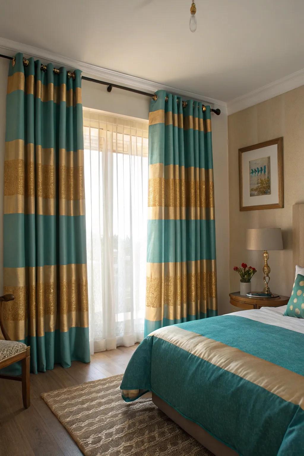 Striped curtains in teal and gold add a bold yet elegant touch to this bedroom.