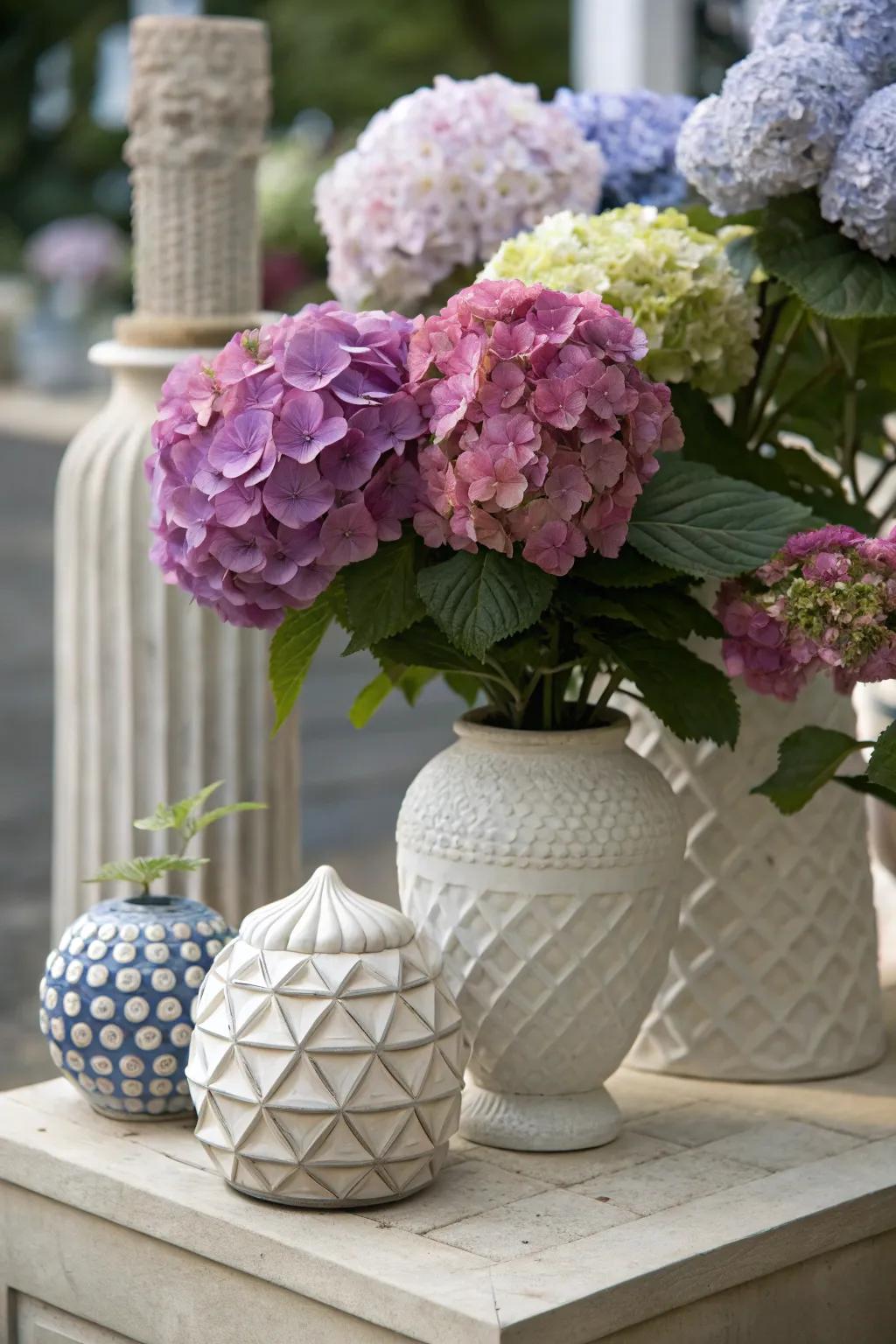 Artistic arrangement of hydrangeas with sculptural elements.