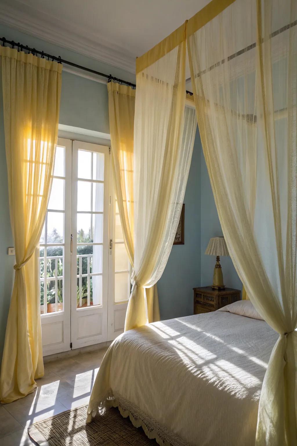 Sheer yellow curtains add a romantic and dreamy ambiance to the bedroom.