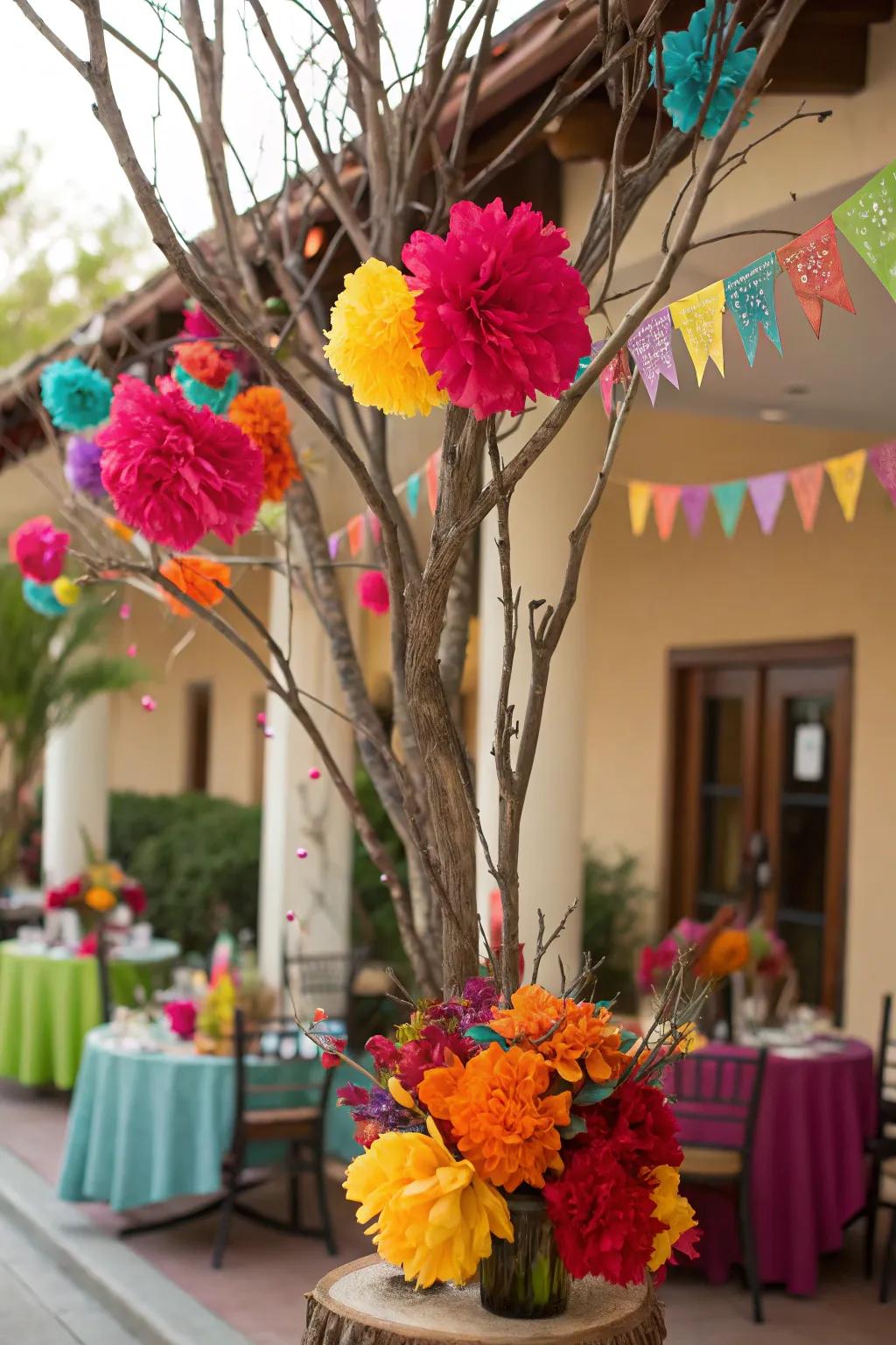 Festive fiesta with bright colors and paper flowers on manzanita branches.