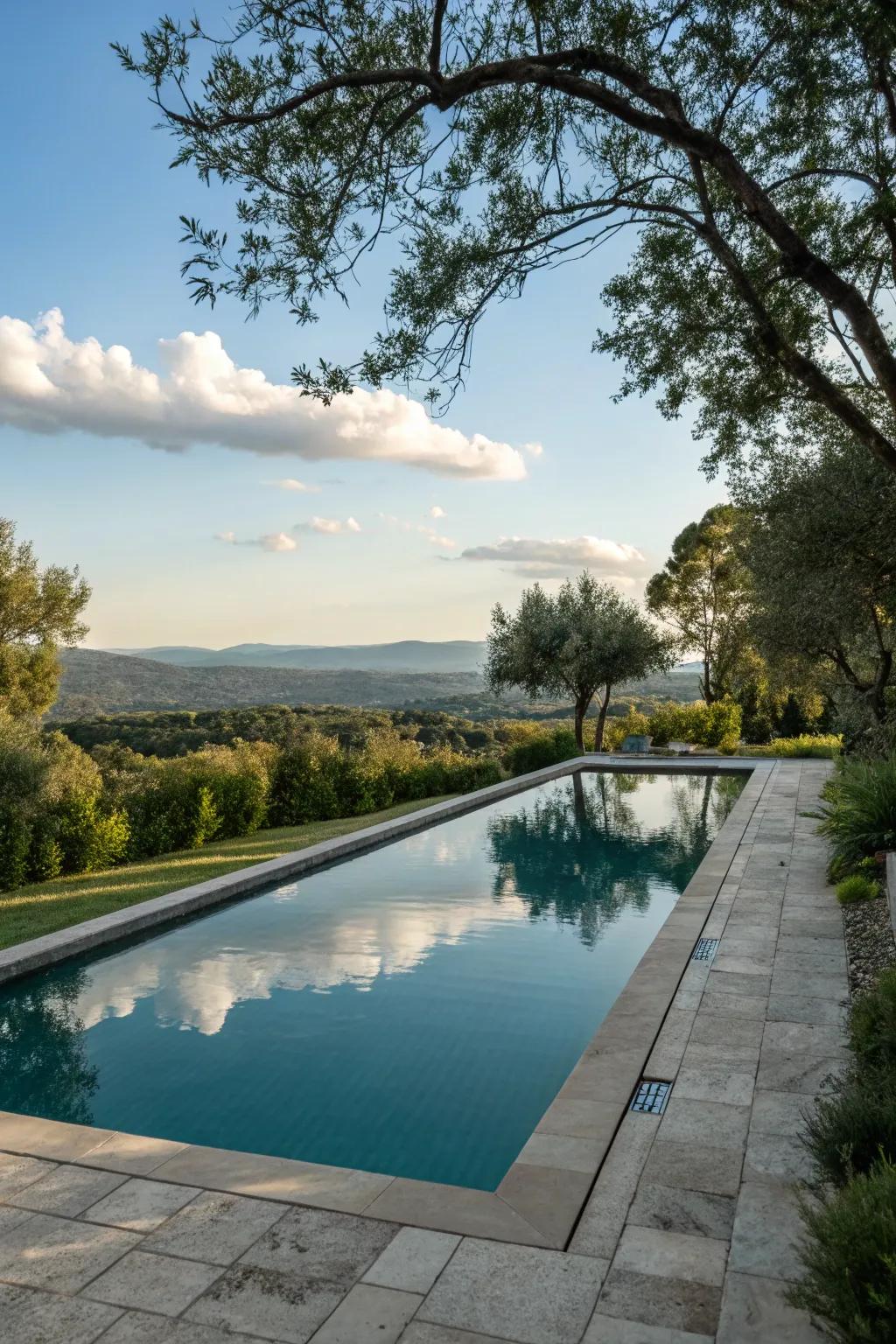 A reflective surface adds elegance and serenity to the pool.