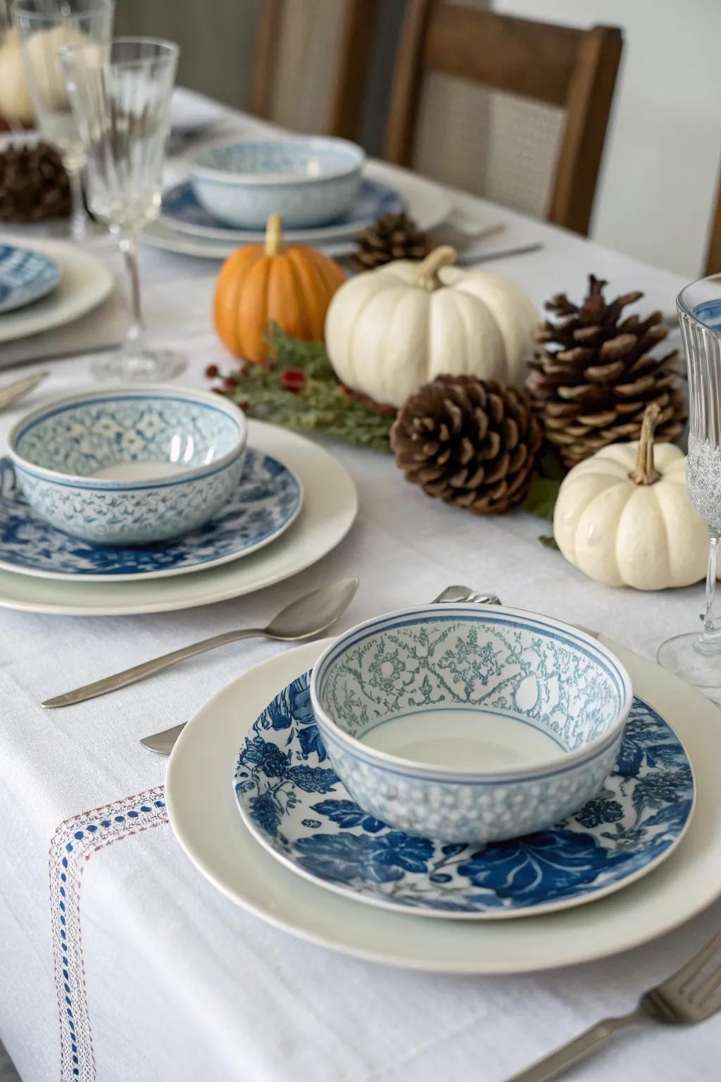 A beautifully set table with blue and white elements for fall.