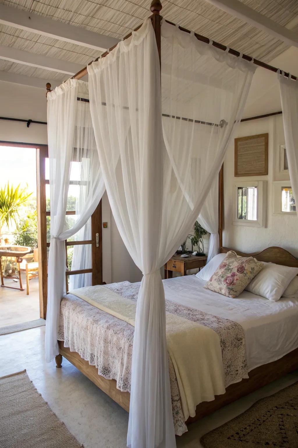 Sheer curtains on a canopy bed keep the space light and airy.