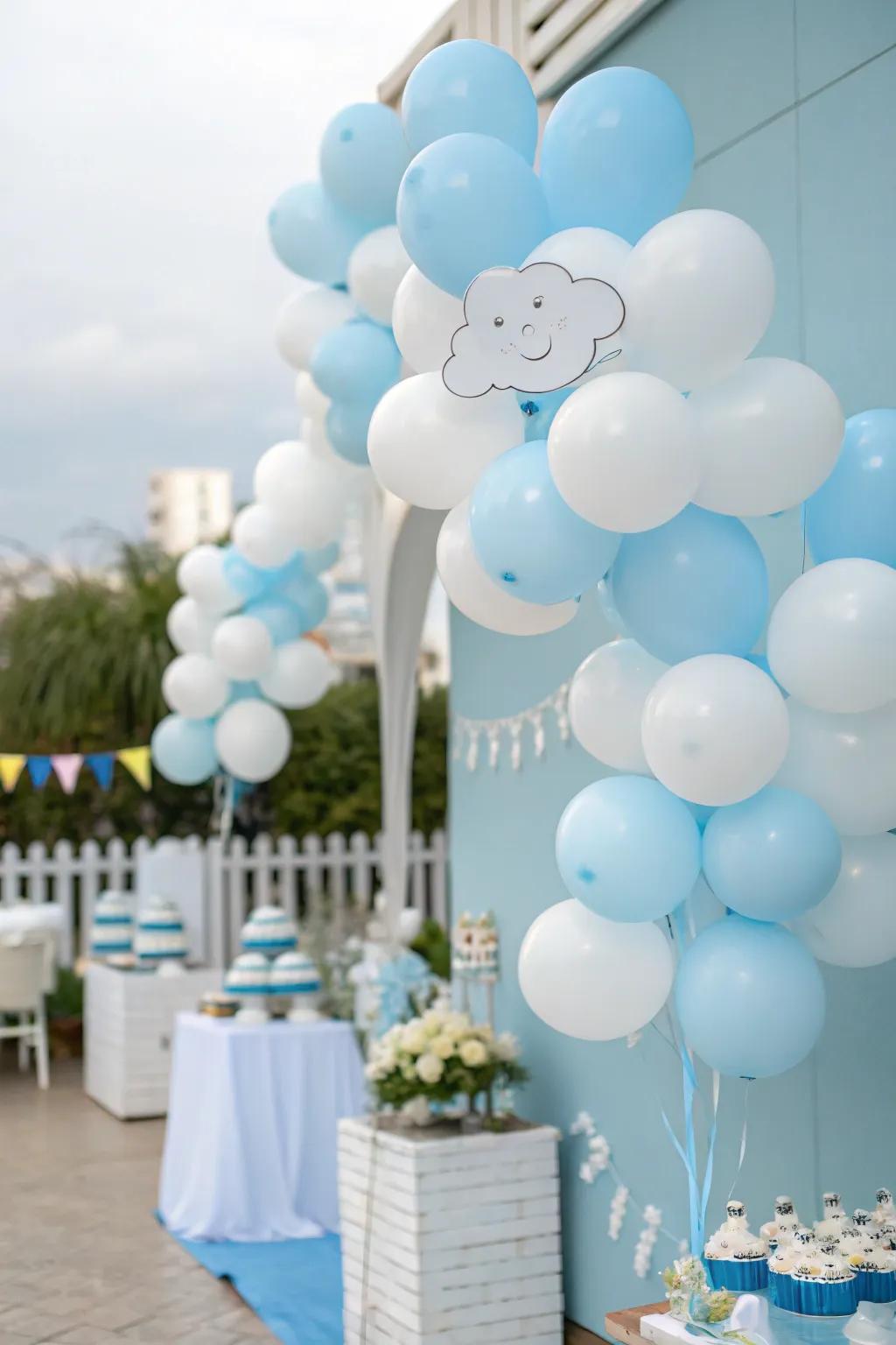 Balloon clusters create a cloud-like effect, adding a whimsical touch to the baby shower decor.