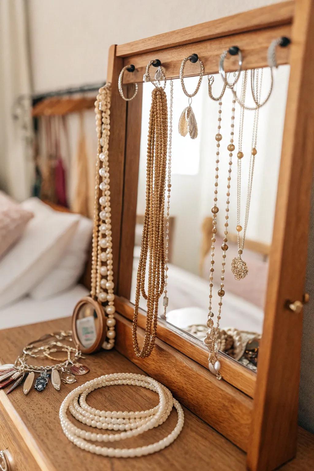 Elegant mirror with jewelry hooks