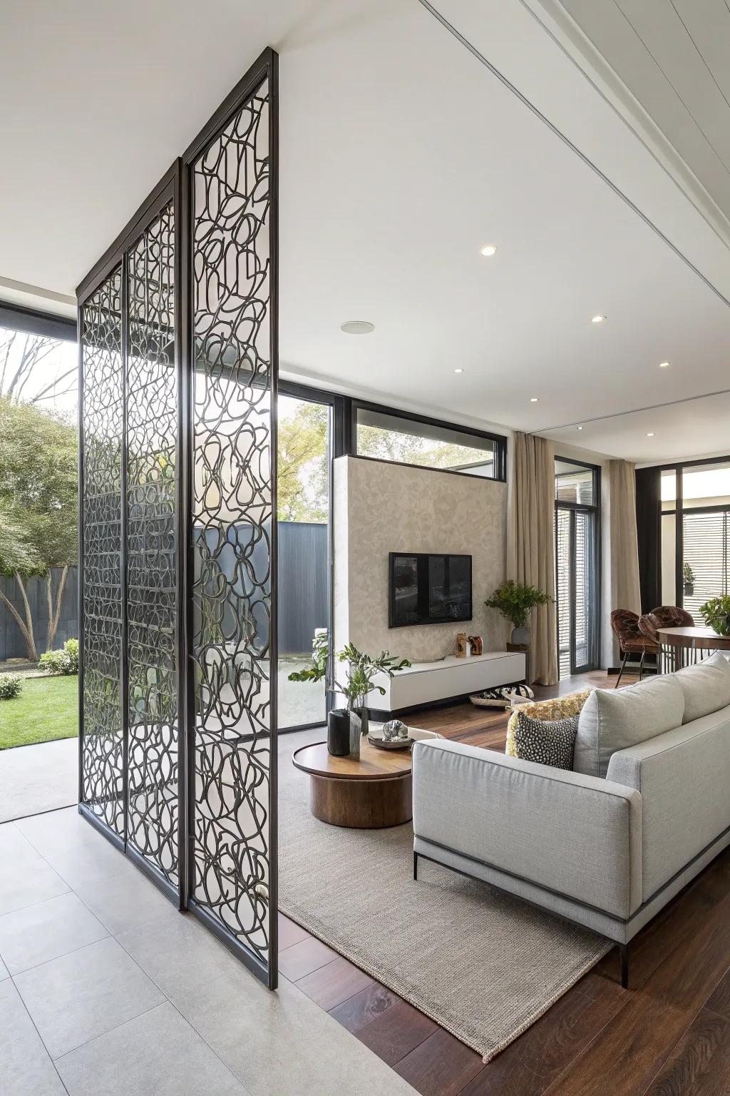 A sleek metal screen wall creates distinct zones in an open-plan living area.