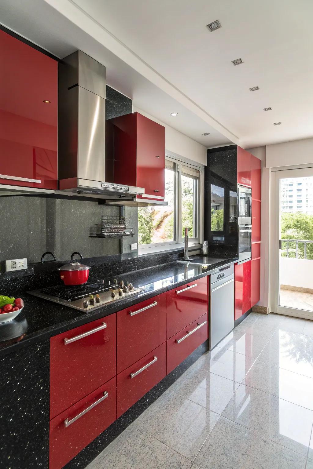 Black granite countertops provide a sleek contrast to red cabinets.