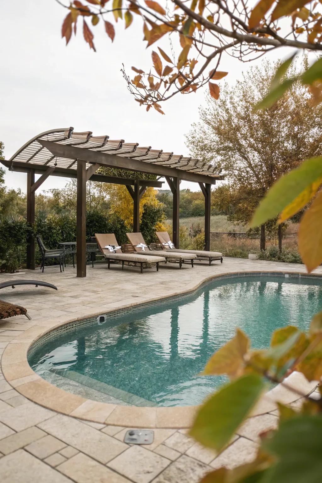 A pergola provides a perfect shaded seating area by the pool.