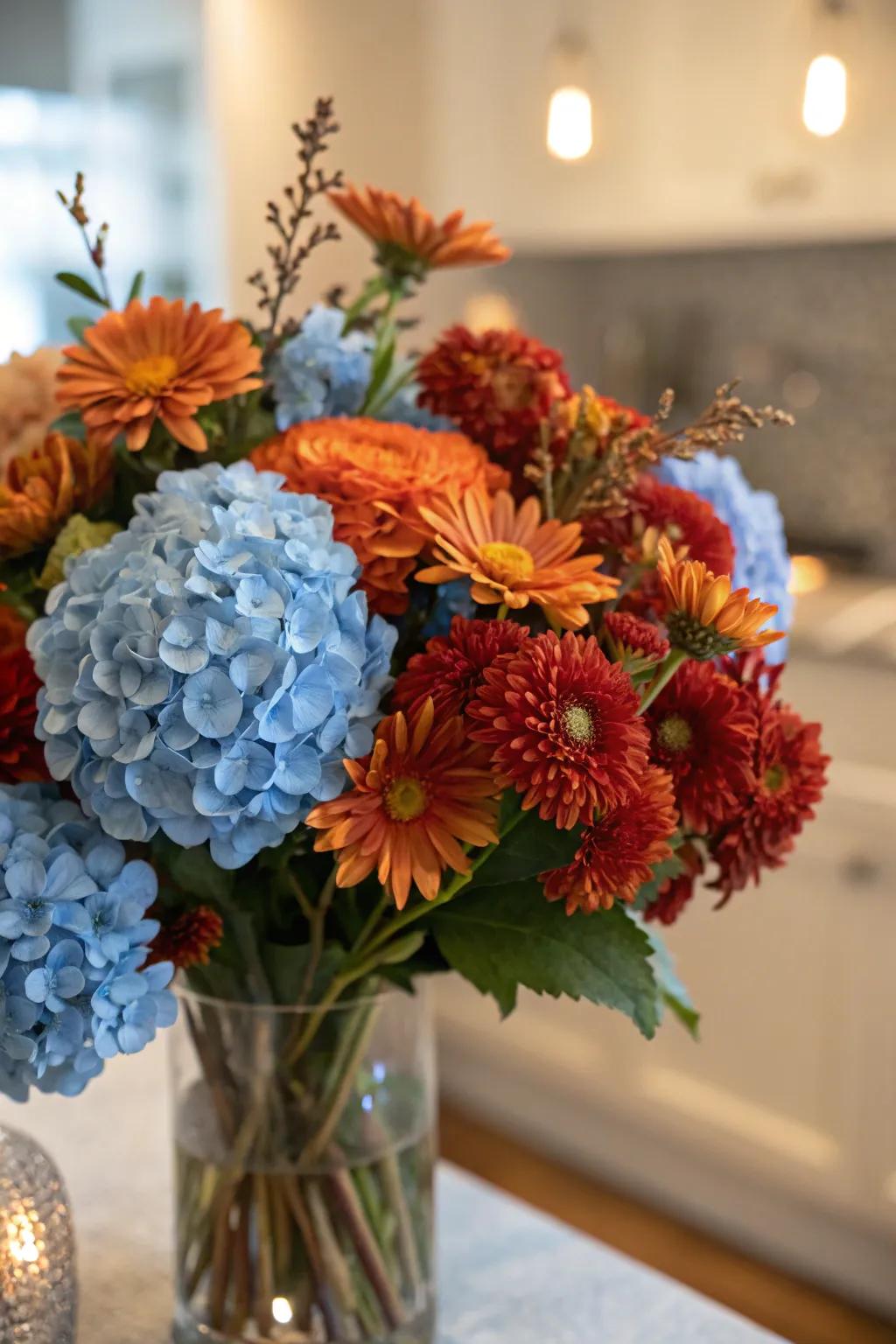 A unique floral arrangement with blue and autumnal elements.