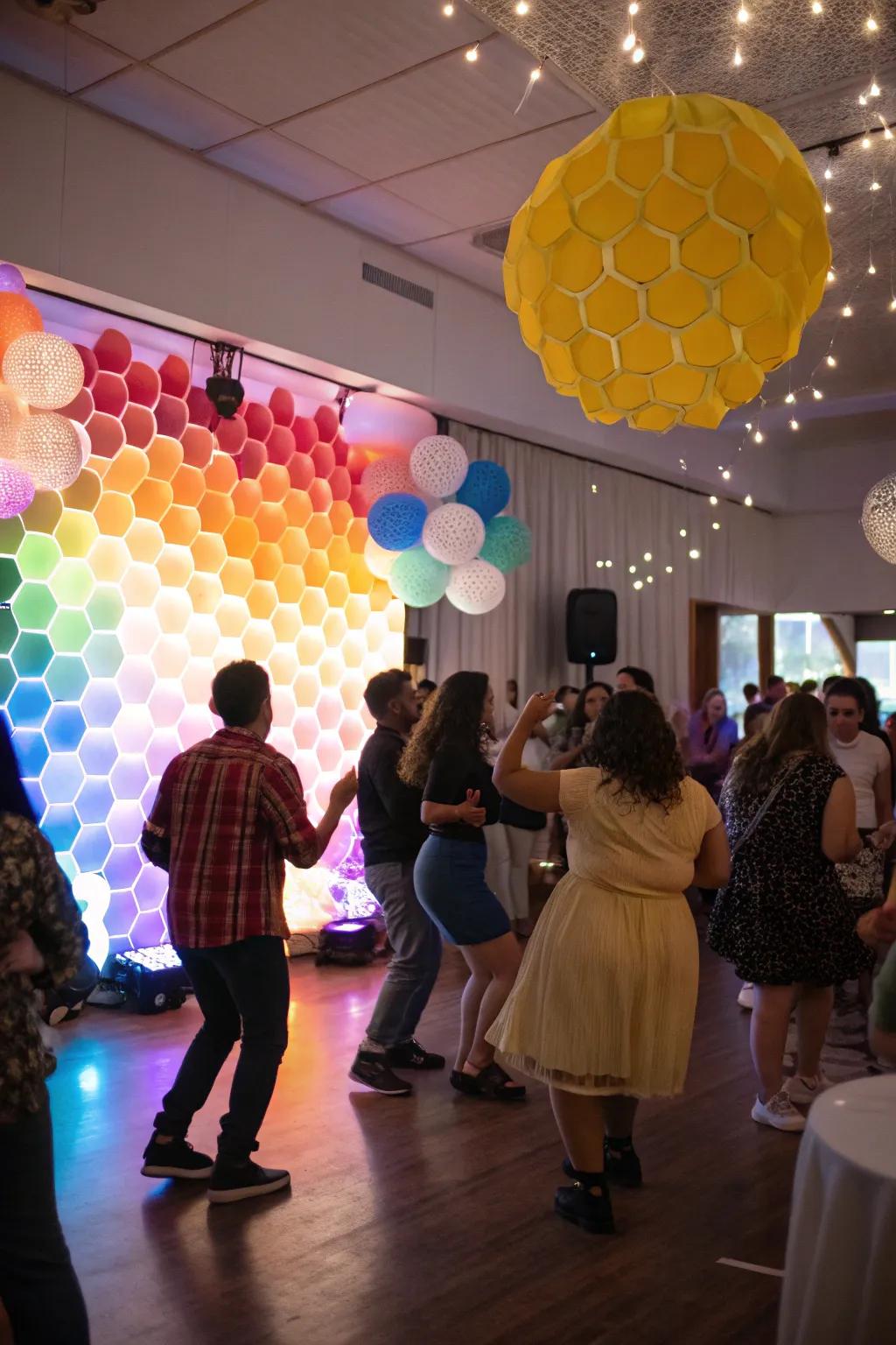 Set the scene with a vibrant honeycomb party backdrop.