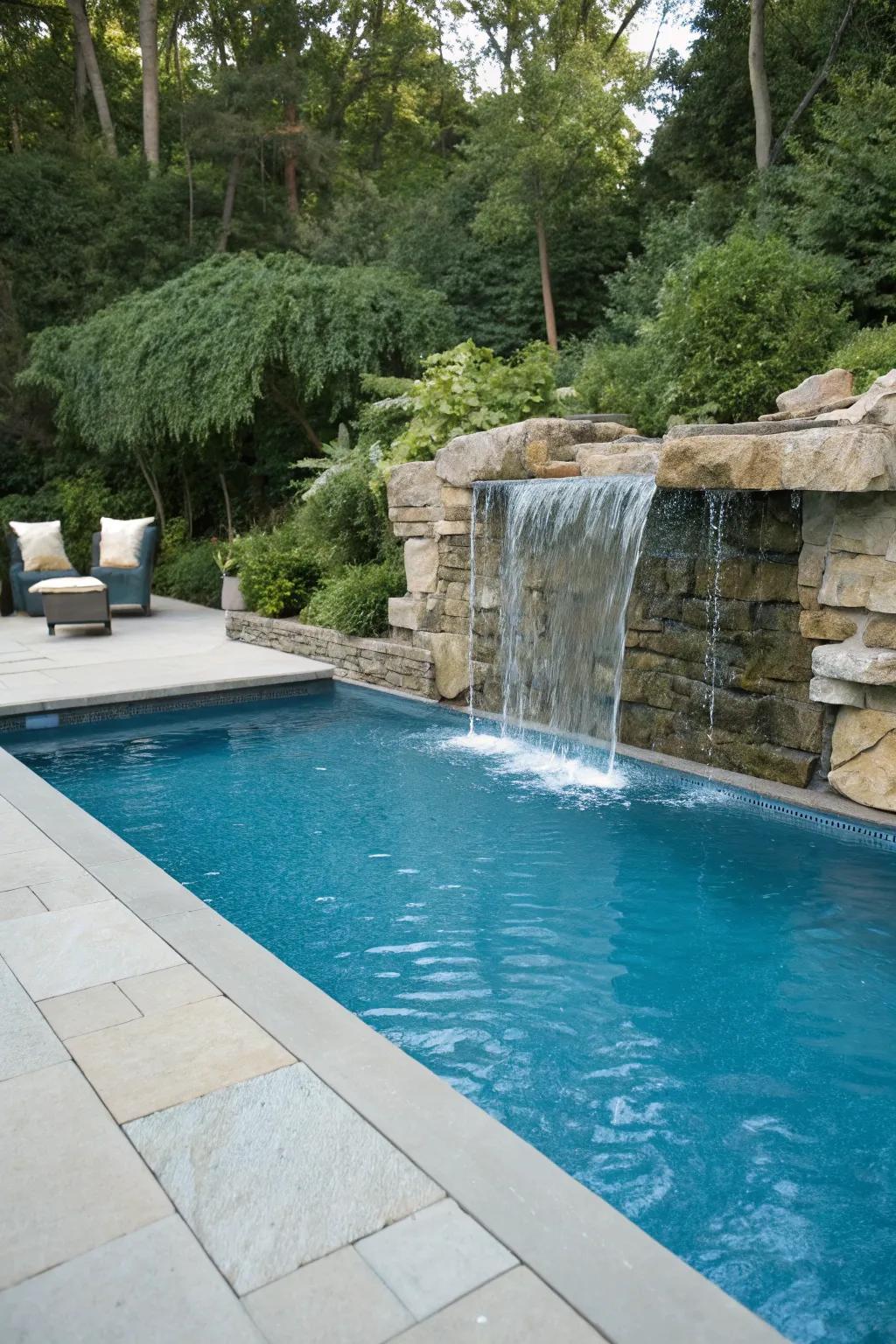 A waterfall feature adds elegance and tranquility to the pool.