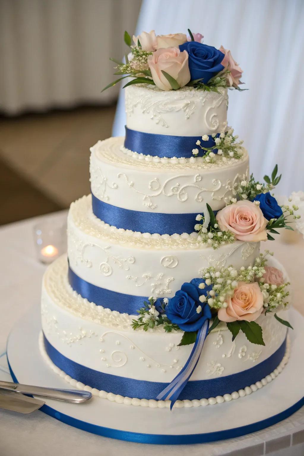 A wedding cake adorned with royal blue accents.